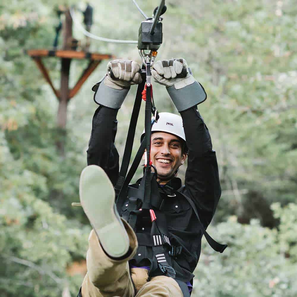 Zip-liner on the Tree Tops Tour